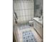 Cozy bathroom featuring a white vanity, elegant tile flooring, and a shower with a stylish curtain at 6301 Park South Dr, Charlotte, NC 28210