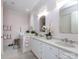 Serene bathroom with double vanity, walk-in tub, and decorative lighting at 6301 Park South Dr, Charlotte, NC 28210