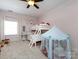 Bright bedroom features twin bunk beds, tent and white walls at 6301 Park South Dr, Charlotte, NC 28210