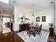 Elegant dining room with hardwood floors and a chandelier at 6301 Park South Dr, Charlotte, NC 28210