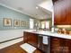 Charming kitchen featuring wood cabinets, stainless steel appliances and tile backsplash at 6301 Park South Dr, Charlotte, NC 28210