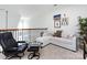 Upstairs living room includes plush couch, black chair and natural light at 6301 Park South Dr, Charlotte, NC 28210