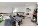 Upstairs living room includes dining area and comfy seating area with plush white couch at 6301 Park South Dr, Charlotte, NC 28210