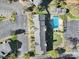 Overhead view of a townhome community with a pool, parking, and landscaped grounds at 6310 Windsor Gate Ln # 15, Charlotte, NC 28215