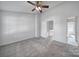 Spacious bedroom with ceiling fan and large closet at 6310 Windsor Gate Ln # 15, Charlotte, NC 28215