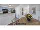 Staged dining area featuring hardwood floors and an open concept view of the kitchen at 6310 Windsor Gate Ln # 15, Charlotte, NC 28215