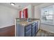 Bright kitchen features gray cabinets, granite countertops, a stainless steel sink, and an open floor plan at 6310 Windsor Gate Ln # 15, Charlotte, NC 28215