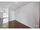 Spacious living room featuring beautiful hardwood floors and plenty of natural light at 6310 Windsor Gate Ln # 15, Charlotte, NC 28215