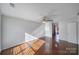 Bright living room featuring hardwood floors and large windows for ample natural light at 6310 Windsor Gate Ln # 15, Charlotte, NC 28215