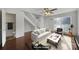 Staged living room with cozy furniture, staircase, and a view into the bathroom at 6310 Windsor Gate Ln # 15, Charlotte, NC 28215