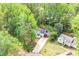 Aerial view showcasing the house nestled among mature trees in a well-manicured neighborhood at 6628 Cool Water Ct, Charlotte, NC 28215