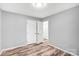 This bedroom features neutral walls and light-toned floors, complemented by a ceiling light at 6628 Cool Water Ct, Charlotte, NC 28215