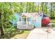 Inviting blue brick home featuring a well-manicured lawn and a cozy front porch at 6628 Cool Water Ct, Charlotte, NC 28215