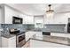 Updated kitchen featuring white cabinets, granite countertops, stainless steel appliances, and a window above the sink at 6628 Cool Water Ct, Charlotte, NC 28215