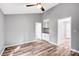 Inviting living room with wood floors, neutral walls, built-in storage, and ample natural light at 6628 Cool Water Ct, Charlotte, NC 28215