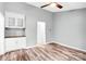 Open-concept living room featuring hardwood floors, built-in cabinets, and neutral paint colors at 6628 Cool Water Ct, Charlotte, NC 28215