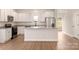 Modern kitchen featuring white cabinets, stainless steel appliances, and an island at 7113 Jerimoth Dr, Charlotte, NC 28215