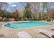 Community pool area with multiple lounge chairs on a sunny day at 7213 Quail Meadow Ln, Charlotte, NC 28210