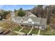 An aerial shot of townhouses showcases rooftops, landscaping, and nearby parking at 7707 Petrea Ln, Charlotte, NC 28227