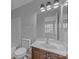 Full bathroom featuring a vanity with a framed mirror, and tub with shower at 7707 Petrea Ln, Charlotte, NC 28227