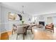 Inviting living space with a dining area, fireplace, and sliding glass doors for natural light at 7707 Petrea Ln, Charlotte, NC 28227