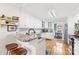 Bright, updated kitchen with white cabinets, granite countertops, and stainless steel appliances with island at 801 Toncin Ave, Bessemer City, NC 28016
