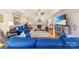 Inviting living room with hardwood floors, fireplace, and blue sofas creating a comfortable gathering space at 801 Toncin Ave, Bessemer City, NC 28016