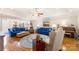 Spacious living room featuring hardwood floors, blue sofas, neutral chairs, and elegant decor at 801 Toncin Ave, Bessemer City, NC 28016