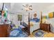 A luxurious main bedroom suite with a four-poster bed, sitting area, and lots of natural light at 801 Toncin Ave, Bessemer City, NC 28016