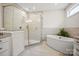 Modern bathroom featuring a glass enclosed shower and soaking tub creating a spa-like retreat at 8601 Balcony Bridge Rd, Huntersville, NC 28078