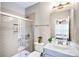 Bathroom featuring shower, blue vanity, and neutral colors at 967 Stebbins Dr, Fort Mill, SC 29715