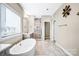 Bathroom featuring a standalone tub, and a glass door shower at 967 Stebbins Dr, Fort Mill, SC 29715