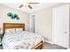 Cozy bedroom with natural wood bed frame, accent wall art, and white door at 967 Stebbins Dr, Fort Mill, SC 29715