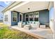 Charming covered patio with outdoor seating, perfect for relaxation and entertaining at 967 Stebbins Dr, Fort Mill, SC 29715