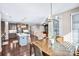 Bright eat-in kitchen featuring an island, stainless steel appliances, and an adjacent living space at 967 Stebbins Dr, Fort Mill, SC 29715