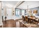 Elegant dining room featuring hardwood floors, ample natural light, and a refined chandelier at 967 Stebbins Dr, Fort Mill, SC 29715