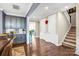 Hallway and staircase with hardwood floors and architectural details that add depth to the home at 967 Stebbins Dr, Fort Mill, SC 29715