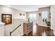 Upstairs landing area featuring hardwood floors, natural light, and decorative accents at 967 Stebbins Dr, Fort Mill, SC 29715