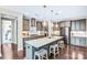 A spacious kitchen features a large island with seating, stainless steel appliances and modern lighting at 967 Stebbins Dr, Fort Mill, SC 29715