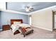 Light filled main bedroom features a ceiling fan, trey ceiling, and a sitting area at 967 Stebbins Dr, Fort Mill, SC 29715