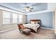 Spacious main bedroom with tray ceiling, ceiling fan, and ample natural light at 967 Stebbins Dr, Fort Mill, SC 29715