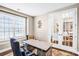 Home office featuring a large desk, comfortable chairs, hardwood floors, and natural light at 967 Stebbins Dr, Fort Mill, SC 29715