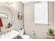 Well-lit half-bath with modern sink, toilet, decorative mirror and accents at 967 Stebbins Dr, Fort Mill, SC 29715