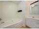 Bathroom featuring a soaking tub, single vanity sink, and modern fixtures at 1017 Village Green Ln, Rock Hill, SC 29730
