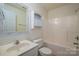 Bright bathroom features a white vanity, toilet, and a shower-tub combination at 1017 Village Green Ln, Rock Hill, SC 29730