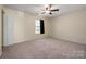 Cozy bedroom features natural light, soft carpet, and a ceiling fan at 1017 Village Green Ln, Rock Hill, SC 29730