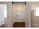 Open closet featuring bi-fold doors, a hanging rack, and a visible laundry hookup at 1017 Village Green Ln, Rock Hill, SC 29730