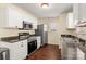 Modern kitchen featuring white cabinetry, stainless steel appliances, and dark countertops at 1017 Village Green Ln, Rock Hill, SC 29730