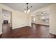 Open-concept living space with hardwood floors and modern lighting fixtures at 1017 Village Green Ln, Rock Hill, SC 29730