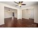 Spacious living area with hardwood floors, ceiling fan, and neutral tones at 1017 Village Green Ln, Rock Hill, SC 29730